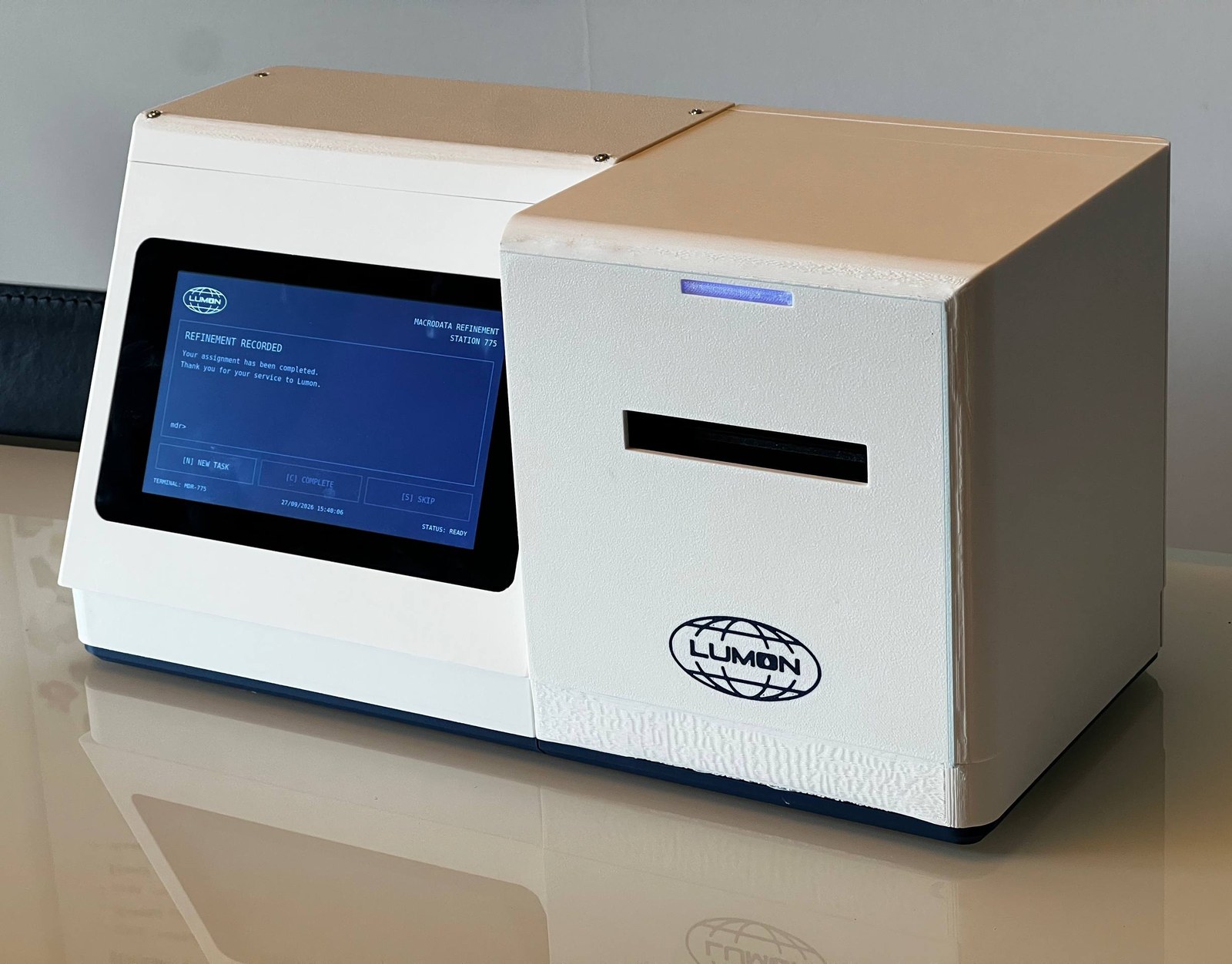 The finished Lumon-inspired task terminal with touchscreen and thermal printer
